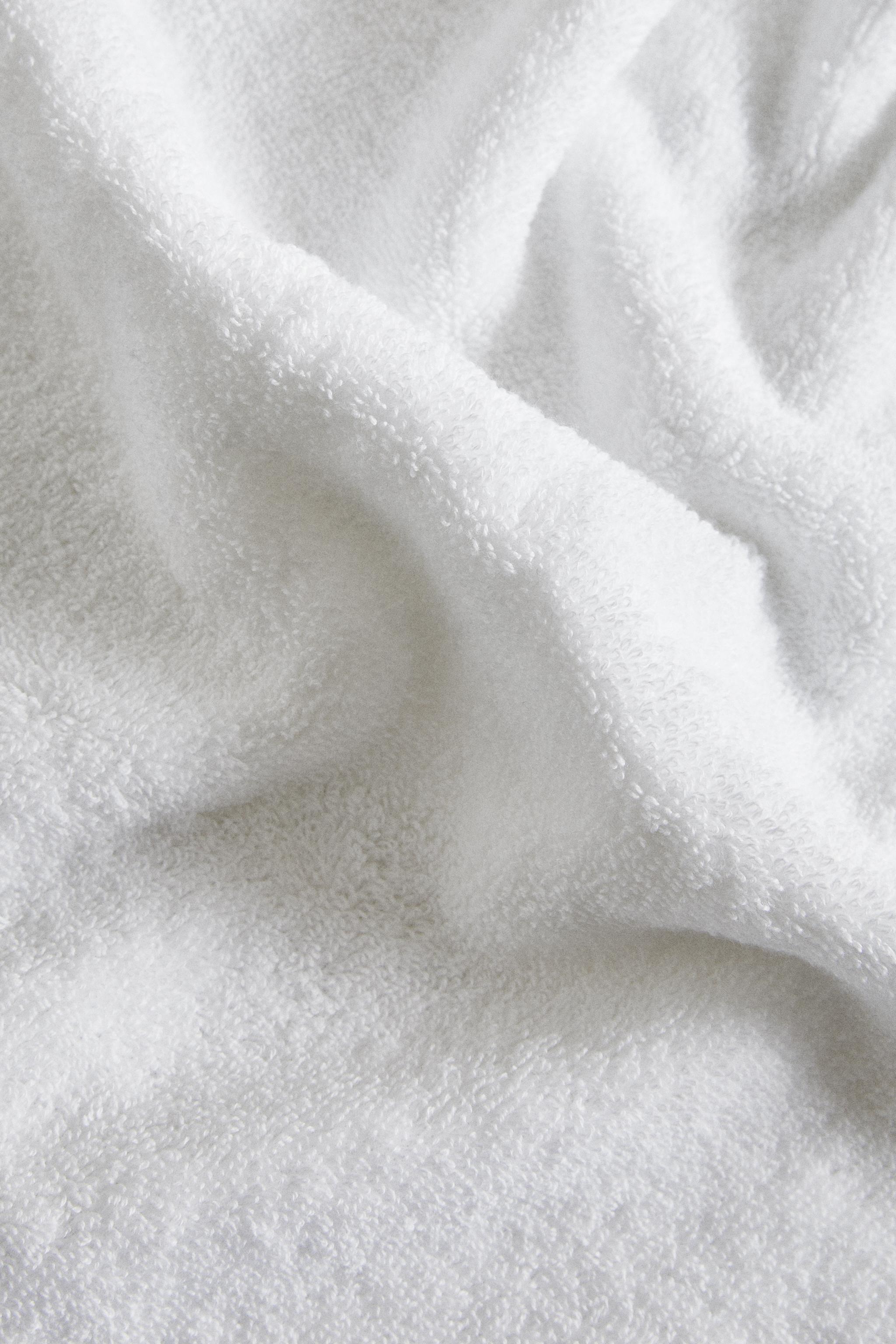 BATH TOWEL WITH PIQUÉ BAND